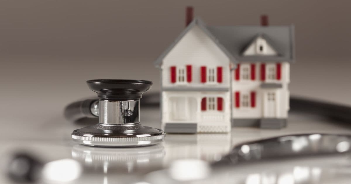 House with a stethoscope around int