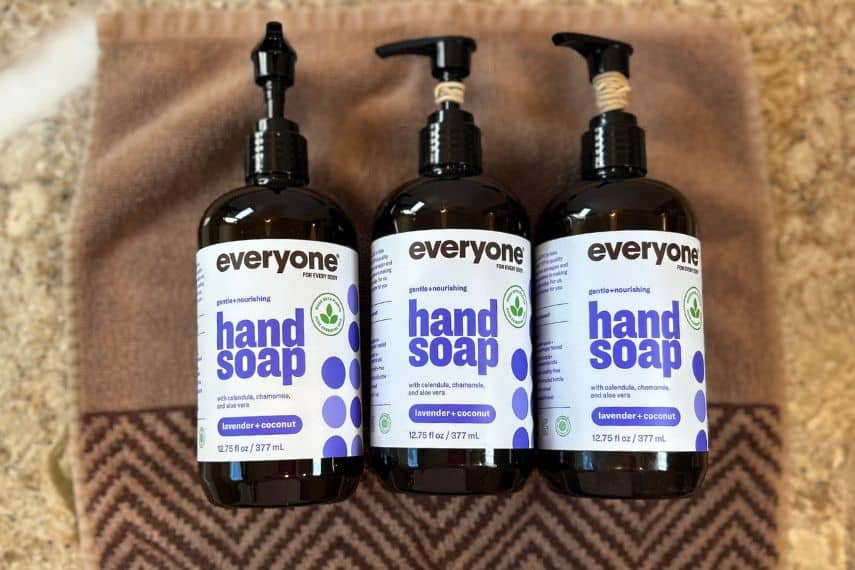 Three pump bottles of Everyone hand soap on bathroom counter.