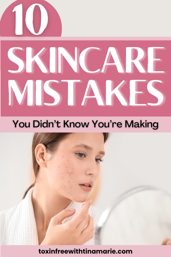 Young woman examines her acne-prone skin in a mirror, highlighting common skincare mistakes. Large pink text above reads "10 Skincare Mistakes."