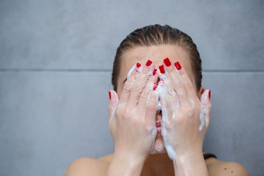 Woman washing her face