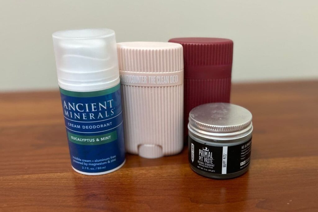 A variety of clean deodorants I use and recommend displayed on tabletop.