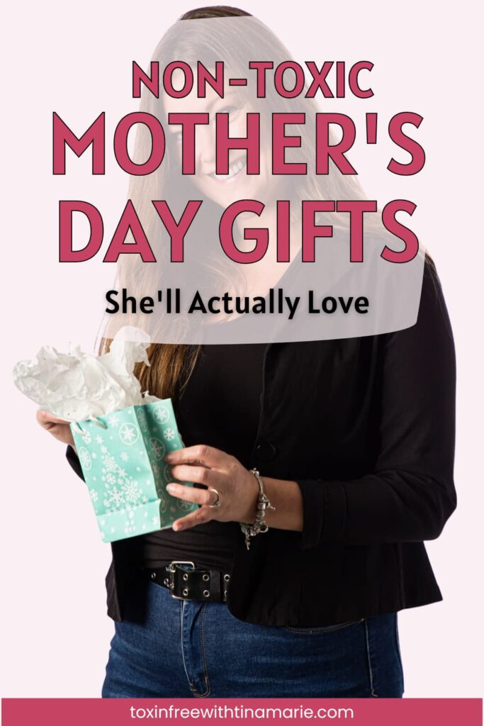 Woman holding a light blue gift bag with tissue paper. Text reads: "Non-Toxic Mother's Day Gifts She'll Actually Love."