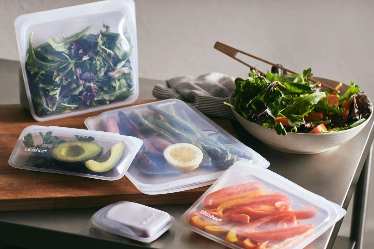 A variety of foods inside assorted Stasher silicone bags.