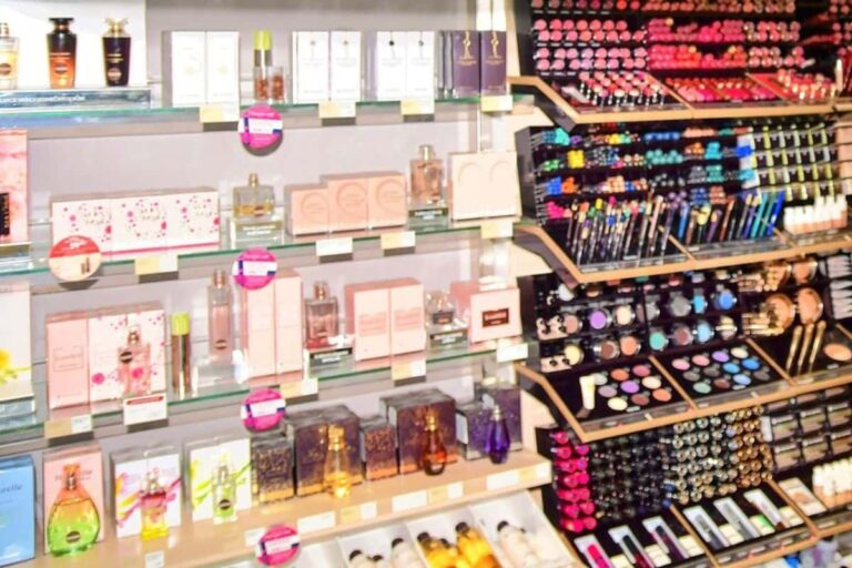 Store display of products with hidden fragrance, thanks to the fragrance loophole. On the shelves are perfumes and cosmetics