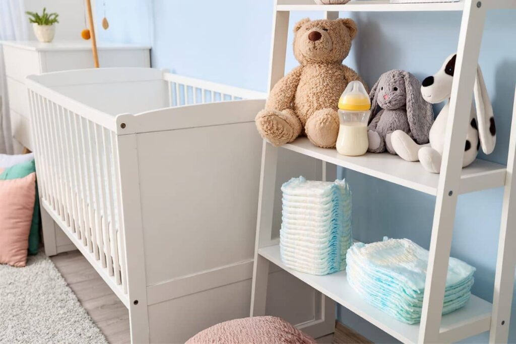 Baby nursery with crib, stuffed animals and diapers that contain hidden fragrance.