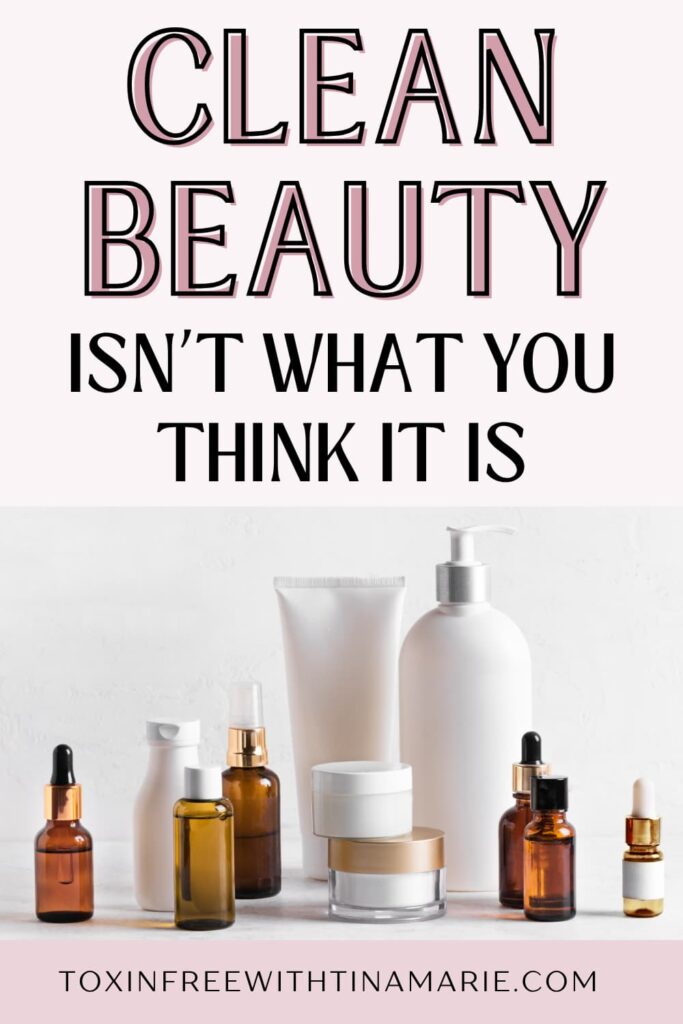 Image with the text 'Clean Beauty Isn't What You Think It Is' above various skincare bottles and jars on a white surface.